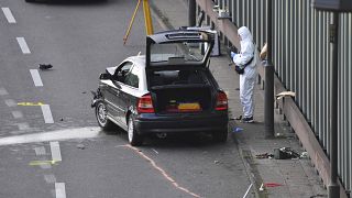 An investigator pictured at the scene on the BAB 100 motorway near Berlin.