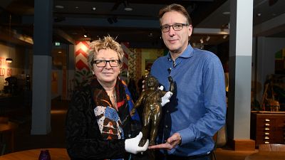 Arthur Brand handed back the bronze sculpture statue of the god Bacchus to the director of the Musee du Pays Chatillonnais in eastern France