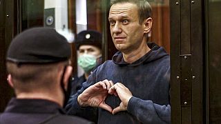  Alexei Navalny makes a heart symbol standing in Moscow City Court