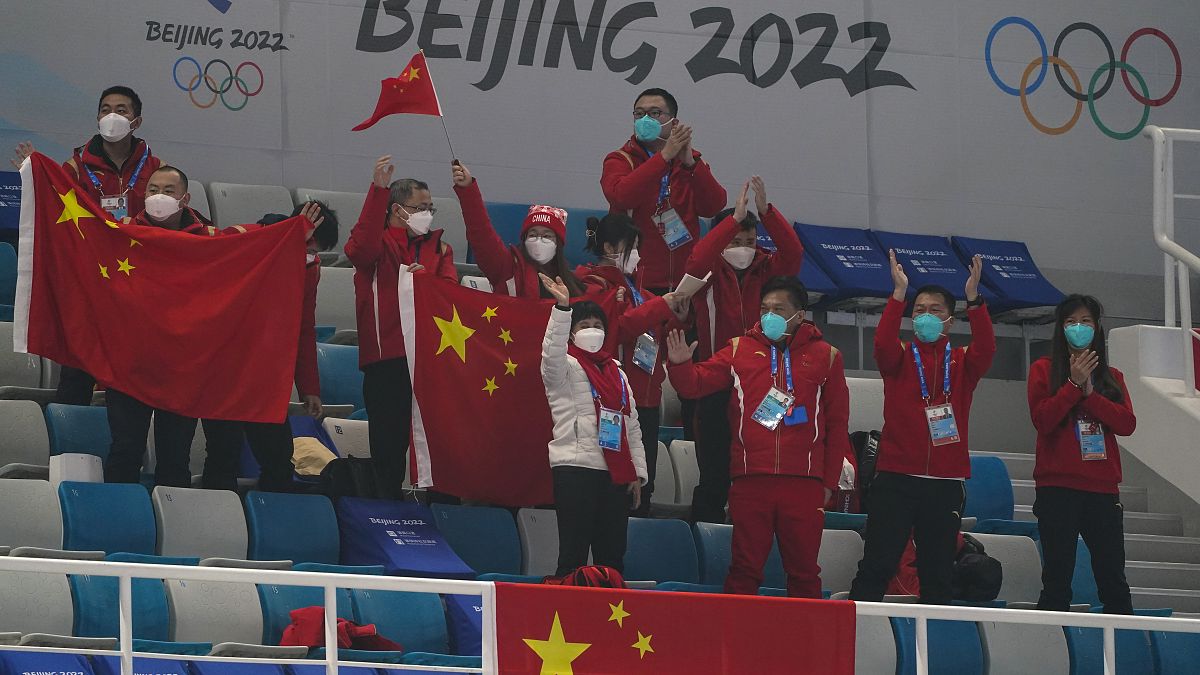 Chinese fans cheer after a China win against Australia during the mixed doubles curling match at the Beijing Winter Olympics Thursday, Feb. 3, 2022, in Beijing. 