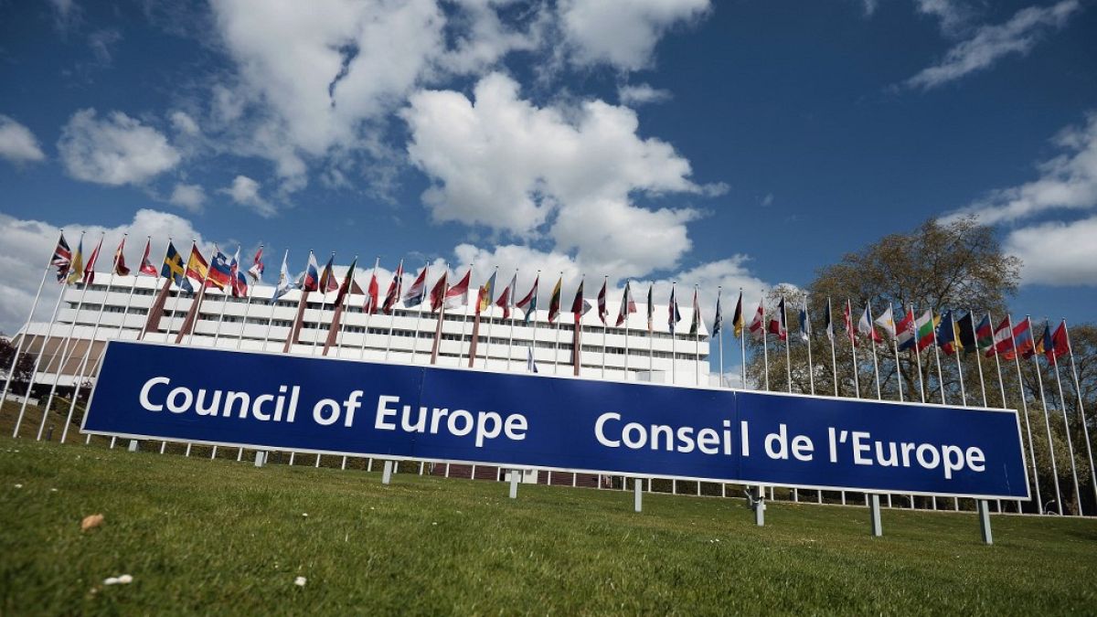 A view of European flags floating in front of the Council of Europe building in Strasbourg.