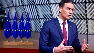 Spain's Prime Minister Pedro Sanchez speaks with the media as he arrives for an EU Summit at the European Council building in Brussels, Dec. 16, 2021.