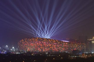 Lights shine during a rehearsal for the opening ceremony of the 2022 Winter Olympics at the National Stadium in Beijing
