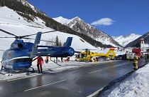 Rescue helicopters stand on a street near the Gammerspitze after an avalanche killed one person on February 4, 2022.