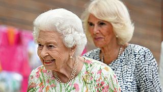 Britain's Queen Elizabeth II, foreground and Camilla, the Duchess of Cornwall, during the G7 summit in Cornwall, England, June 11, 2021.