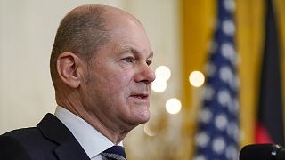 German Chancellor Olaf Scholz speaks during a news conference with President Joe Biden in the East Room of the White House