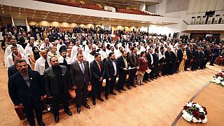 صورة أرشيفية للمشرعين العراقيين المنتخبين حديثاً في افتتاح الجلسة الأولى للبرلمان ببغداد 9 يناير 2022