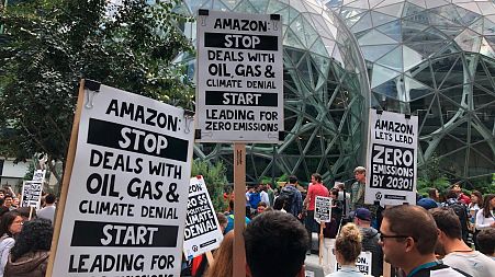 Amazon workers begin to gather in front of the Spheres, participating in the climate strike in Seattle.