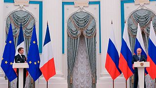 Russian President Vladimir Putin, right, and French President Emmanuel Macron attend a joint news conference following their talks in Moscow, Russia, Monday, Feb. 7, 2022.