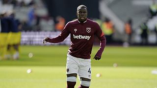 West Ham United defender Kurt Zouma (4) warms up before an English Premier League soccer match against Brentford at London Stadium 