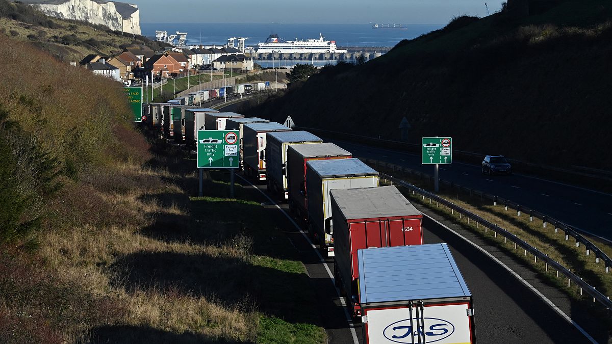 Lorries queue to embark on a ferry at the Port of Dover, southeast England, on January 13, 2022.