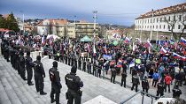 Protesters gathered in front of the parliament during the debate on the new Defense Cooperation Agreement.