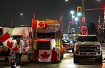 Truckers and supporters block access from the Ambassador Bridge, linking Detroit and Windsor, in protests against COVID vaccine mandates and restrictions. Feb. 9, 2022.