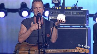 Sting accepts the award of merit at the American Music Awards at the Microsoft Theater on Sunday, Nov. 20, 2016, in Los Angeles