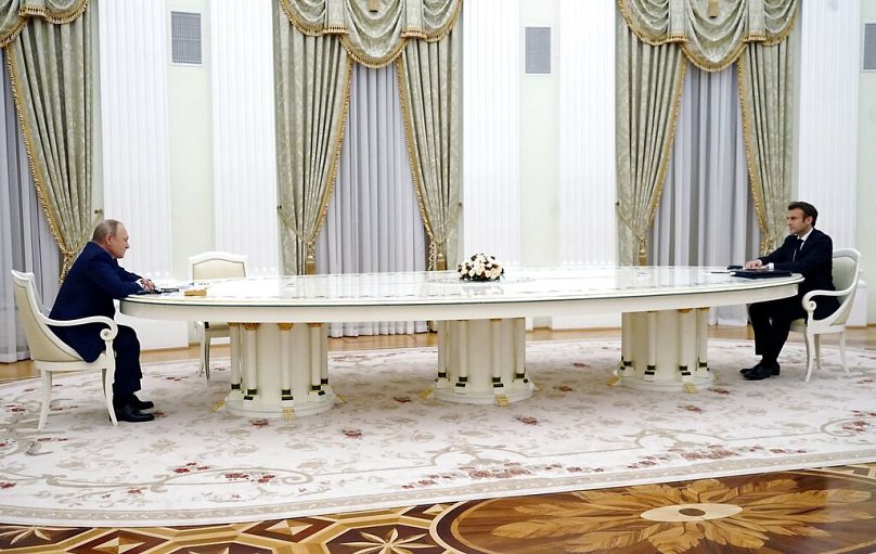 FILE: Russian President Vladimir Putin listens to French President Emmanuel Macron during their meeting in the Kremlin in Moscow, 7 February 2022
