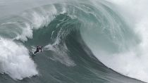 Surfers take on the big waves at the Tow Surfing Challenge in Portugal
