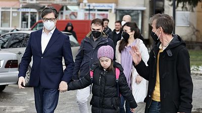 The President of the Republic of North Macedonia, Stevo Pendarovski, holds the hand of Embla Ademi as he walks her to school on February 7, 2022. The President of the Republic of North Macedonia, Stevo Pendarovski, holds the hand of Embla Ademi as he walks her to school on February 7, 2022.