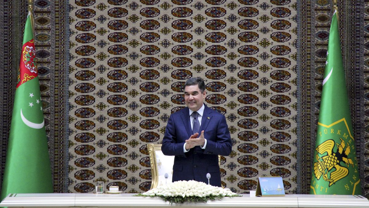 Turkmenistan's President Gurbanguly Berdymukhamedov applauds as he attends an opening ceremony of a chemical plant in 2018