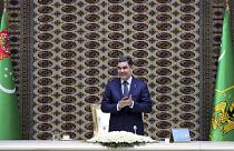 Turkmenistan's President Gurbanguly Berdymukhamedov applauds as he attends an opening ceremony of a chemical plant in 2018