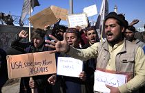Участники акции протеста призывают вернуть деньги Афганистану