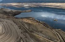 The roof of an old house, submerged three decades ago when a hydropower dam flooded the valley, is photographed emerged due to drought at the Lindoso reservoir, in northwester