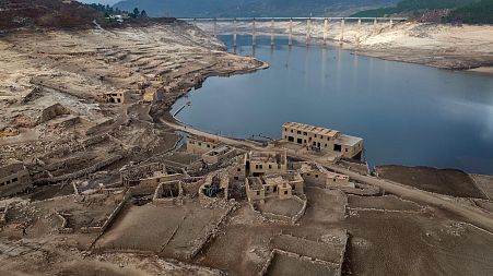 Parts of the old village of Aceredo, submerged three decades ago when a hydropower dam flooded the valley, are photographed emerged due to drought at the Lindoso reservoir.
