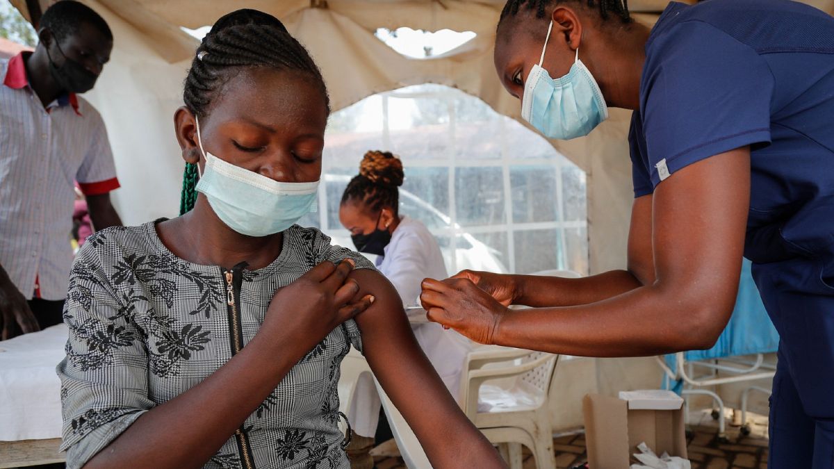 A nurse administers an AstraZeneca vaccine against COVID-19 at a district health centre in the low-income Kibera neighbourhood of Nairobi, Kenya, Jan. 20, 2022.