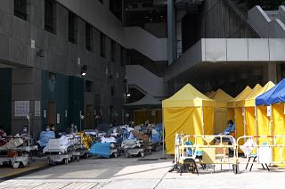 Caritas Medical Centre's Accident and Emergency department in Hong Kong, beds and tents placed outside entrance.