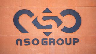 A logo adorns a wall on a branch of the Israeli NSO Group company.