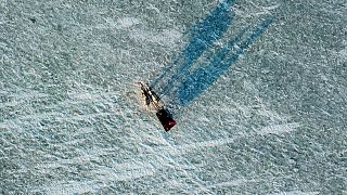 Orhan Goller takes tourists for a ride on the frozen Lake Çıldır in Turkey