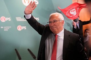 Portuguese Prime Minister and Socialist Party Secretary General Antonio Costa waves to supporters following the election result.