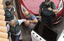 Members of the Spain's Civil Guard lead the suspect away after his arrest in April 2019.