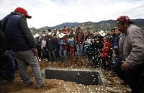 Family and friends grieve around the grave of anti-logging activist Homero Gomez Gonzalez in Ocampo, Michoacan state, Mexico.
