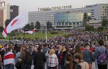 People with old Belarusian national flags gather during an opposition rally in Minsk in September 2020.