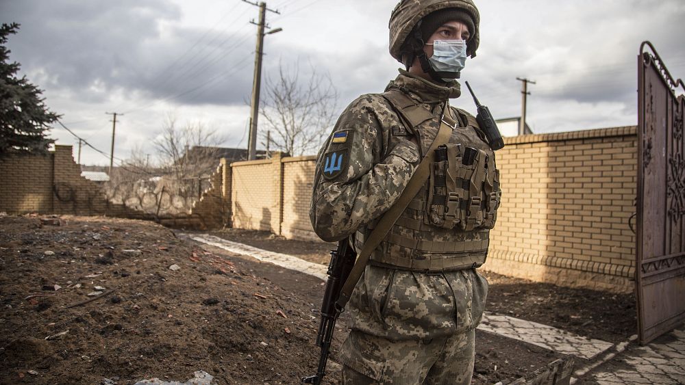 Munich, Germany. 19th Feb, 2022. Participant with sign „Ukr Nato