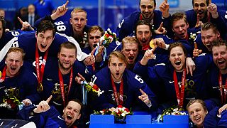 Finland players celebrate after defeating Russian Olympic Committee in the men's gold medal hockey game at the 2022 Winter Olympics