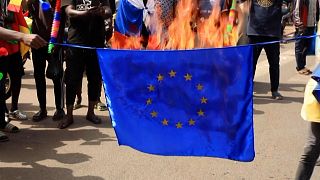 Malians celebrate French retreat by burning EU flag