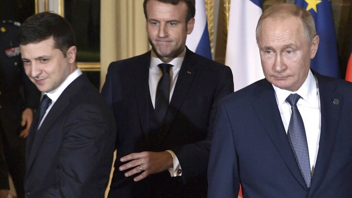FILE - Macron, Putin, Zelenskiy arrive for a working session at the Elysee Palace, in Paris, France, Monday, Dec. 9, 2019