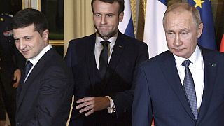 FILE - Macron, Putin, Zelenskiy arrive for a working session at the Elysee Palace, in Paris, France, Monday, Dec. 9, 2019