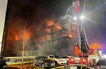Firefighters battle a fire at residential complex in Essen Germany, Feb. 21, 2022.