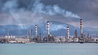 Smoke over an oil refinery.