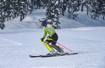 Indian skier Arif Mohammad Khan skies down a slope during a training session at a ski resort in Gulmarg