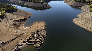 An old village submerged since 1954 when a hydropower dam flooded the valley, rise above the waters of the Zezere River due to drought, in central Portugal, Feb. 17, 2022.