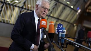 Josep Borrell speaks with the media as he arrives for the EU foreign ministers meeting in Brussels.