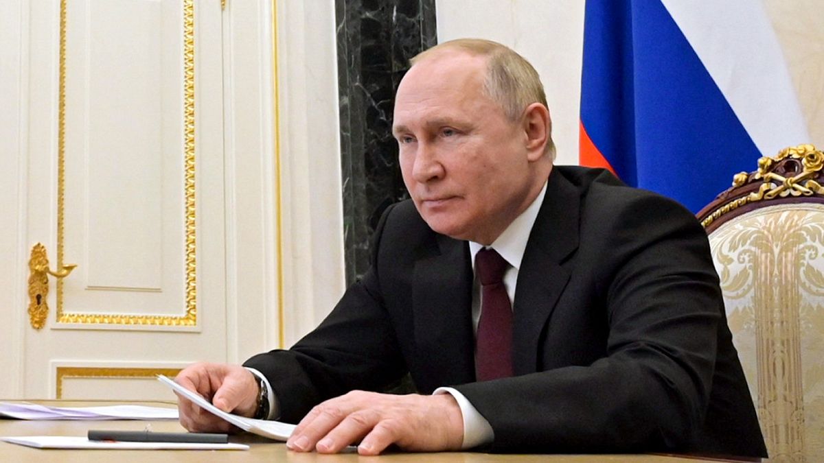 Russian President Vladimir Putin talks via videoconference, February 21, 2022.