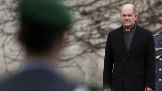 German Chancellor Olaf Scholz waits for Ireland's Prime Minister Micheal Martin at the chancellery in Berlin, Germany, Tuesday, Feb. 22, 2022.