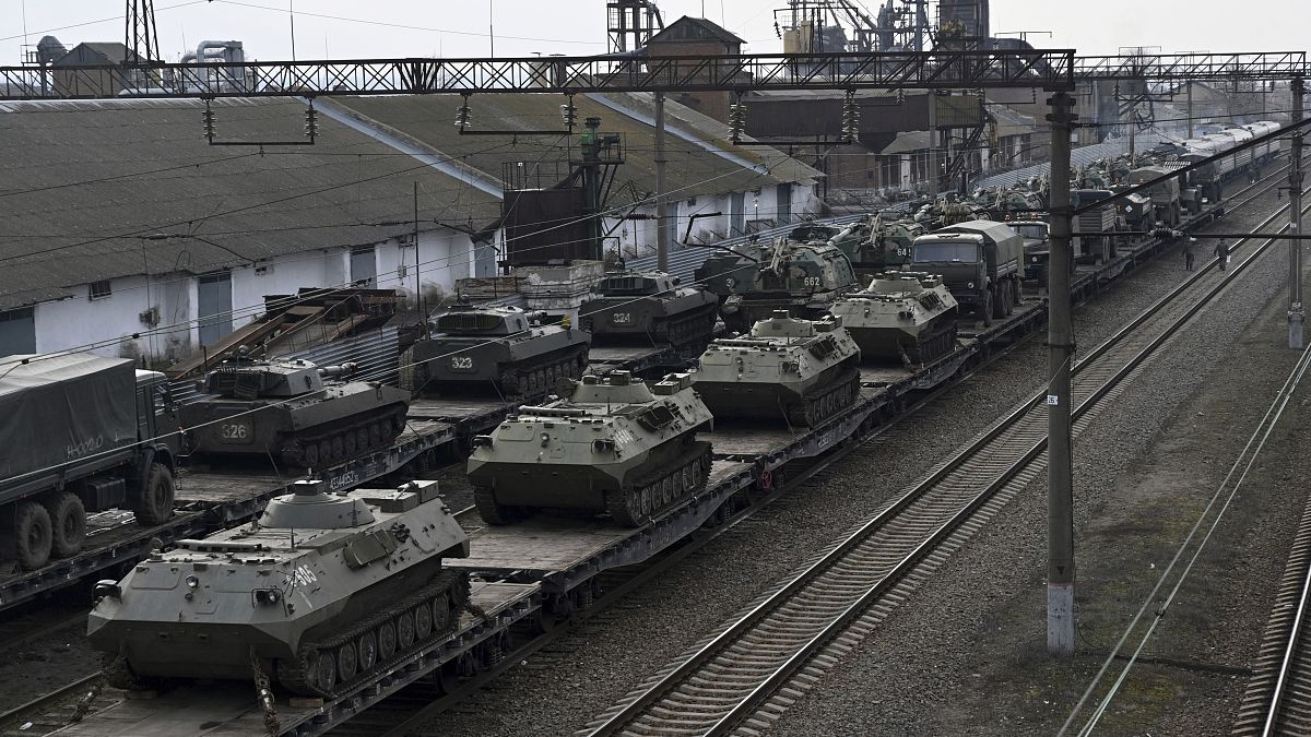 Russian armored vehicles are loaded onto railway platforms at a railway station in region not far from Russia-Ukraine border, in the Rostov-on-Don region, Russia, Feb.23, 2022