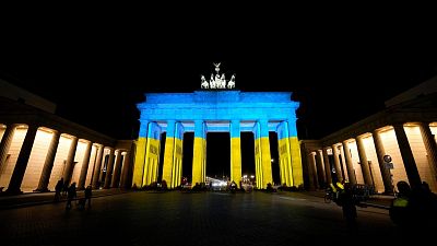 Berlin’s Brandenburg Gate displayed the yellow and blue colours of Ukraine in an act of solidarity