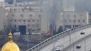 Smoke and flame rise near a military building after an apparent Russian strike in Kyiv