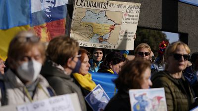 Ukrainians who live in Rome protest near the Russian Embassy in Rome, Thursday, Feb. 24, 2022. 
